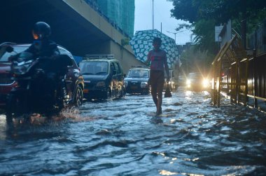 MUMBAI, INDIA - AUGUST 24: Vehicles way through the waterlogged on the road during monsoon rain, at Byculla area, on August 24, 2024 in Mumbai, India. (Photo by Bhushan Koyande/Hindustan Times  clipart