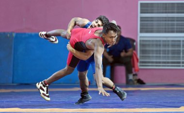 SONIPAT INDIA MAY 17 2023 Wrestler Shubham Blue jersey 48kg weight in action during a selection trial for the Asian Championships U17 and U23 at SAI stadium sports authority of India Bhalgarh  clipart