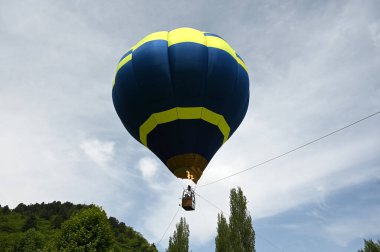 SRINAGAR INDIA MAY 12 2023 Tourists enjoy a hot air balloon ride during a G20 event organised by the Jammu and Kashmir Tourism Deparment at Zabarwan Park on the banks of Dal Lake on May 12 2023 in Srinagar India The department is organising hot air b clipart