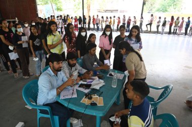 GURUGRAM INDIA MAY 7 2023 A National Eligibility cum Entrance Test NEET candidates stand in a queue for thermal screening before entering the examination centre in Drona Public School at Ravi Nagar Basai Road near Government college sector 9 on May 7