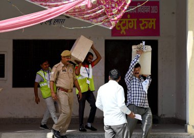 GREATER NOIDA INDIA MAY 13 2023 Election Commission staff carrying the ballot papers for the local body elections at Mihir Bhoj PG College in Dadri on May 13 2023 in Greater Noida India The Bhartiya Janata Party swept the Uttar Pradesh local body pol clipart