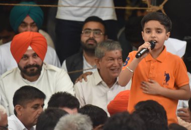 NEW DELHI INDIA MAY 1 2023 Children support of Wrestlers Bajrang Punia Sakshi Malik Vinesh Phogat and others during the Ninth day dharna their protest against the Wrestling Federation of India president Brij Bhushan Saran at Jantar Mantar on May 1 20 clipart