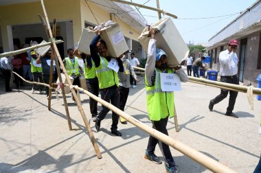 GREATER NOIDA INDIA MAY 13 2023 Election Commission staff carrying the ballot papers for the local body elections at Mihir Bhoj PG College in Dadri on May 13 2023 in Greater Noida India The Bhartiya Janata Party swept the Uttar Pradesh local body pol clipart