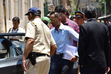 MUMBAI INDIA MAY 22 2023 Former Zonal Director of Mumbai Narcotics Control Bureau Sameer Wankhede being escorted outside the Bombay High Court after the court extended his interim protection against coercive action in the bribery case in connection w clipart