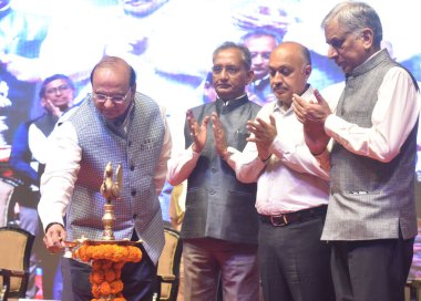 NEW DELHI INDIA MAY 1 2023 Lt Governor of Delhi Vinai Kumar Saxena along with Delhi chief secretary Naresh Kumar Secretary MSDE Atul Kumar Tiwari NDMC Chairman Amit Yadav Light the Lamp during the distribute Recognition to Prior Learning RPL certific clipart