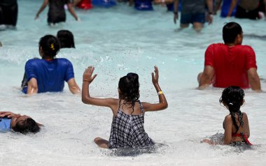 NOIDA INDIA MAY 21 2023 People enjoy at a water park in GIP Mall on a hot sunny day Temperatures are likely to reach around 44C on May 21 2023 in Noida India Photo by Sunil Ghosh Hindustan Times  clipart