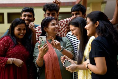 NAVI MUMBAI INDIA MAY 25 2023 Students of Fr Agnel Multipurpose School & Junior College celebrate after the HSC Class 12th Board Exam results were declared at Vashi on May 25 2023 in Navi Mumbai India A total of 14 16 371 students appeared for Mahara clipart