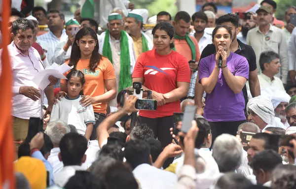 stock image NEW DELHI INDIA MAY 7 2023 Wrestlers Vinesh Phogat and Sakshi Malik Sangeeta Phogat address farmers and supporters during their protest against the Wrestling Federation of India president Brij Bhushan Sharan at Jantar Mantar on May 7 2023 in New Delh