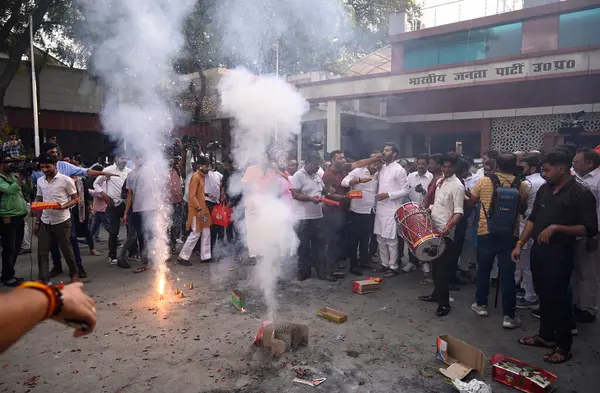 stock image LUCKNOW INDIA MAY 13 2023 BJP Party workers celebrating BJP s landslide victory by burning fire crakers at party head office on May 13 2023 in Lucknow India The Bhartiya Janata Party swept the Uttar Pradesh local body polls as it won all 17 Mayor sea