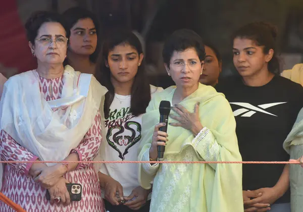 stock image NEW DELHI INDIA MAY 5 2023 Congress leaders Kumari Selja Kiran Choudhry meet with Wrestlers Sakshi Malik Sangeeta Phogat and others during their protest against the Wrestling Federation of India presidentBrij Bhushan Sharan at Jantar Mantar on May 5 