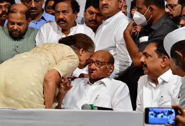 stock image MUMBAI INDIA MAY 2 2023 Nationalist Congress Party NCP chief Sharad Pawar with his wife at the launch of the second part of his autobiography Lok Majhe Sangati Political Autobiography made the announcement of his retirement at Y B Chavan Centre Narim