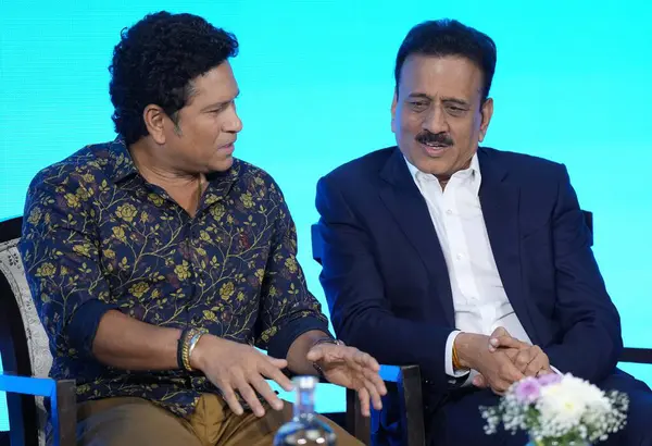 stock image MUMBAI INDIA MAY 30 2023 Maharashtra Deputy Chief Minister Devendra Fadnavis with Maharashtra Minister for Sports and Youth Welfare Girish Mahajan announce former cricketer Sachin Tendulkar as Smile Ambassador for Maharashtra s Swachh Mukh Abhiyan at