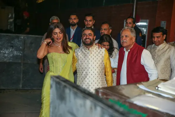 stock image NEW DELHI INDIA MAY 13 2023 Bollywood actor Priyanka Chopra Jonas with her brother Siddharth Chopra C during the engagement ceremony of Bollywood actor Parineeti Chopra and AAP leader Raghav Chadha at Kapurthala House on May 13 2023 in New Delhi Indi