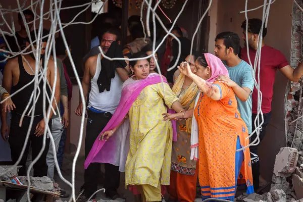 stock image NEW DELHI INDIA MAY 22 2023 Locals were seen taking out their valuables from the demolished structures as DDA along with the district administration carries out demolishing drive of illegal constructions at Kasturba Nagar near Vishwas Nagar on May 22