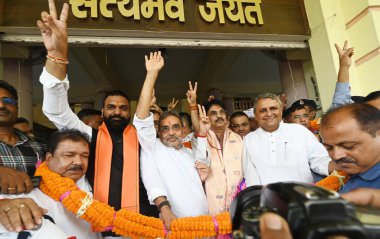 PATNA INDIA AUGUST 27 2024 Bihar Deputy Chief Minister Samrat Chaudhary with NDA candidates Upendar Kushwaha and Manan Kumar Mishra flash victory sign after the Rajya Sabha result at Bihar Assembly on August 27 2024 in Patna India Photo by Santosh Ku clipart