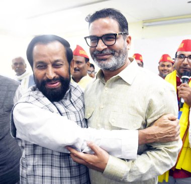 PATNA INDIA AUGUST 27 2024 Former Union Minister and Samajwadi leader Devendra Prasad Yadav being welcomed by Jan Suraj founder Prashant Kishore after he join the party during Milan Samaroh at Gyan Bhawan on August 27 2024 in Patna India Photo by San clipart