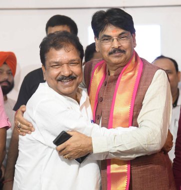 PATNA INDIA AUGUST 27 2024 NDA winning candidate Manan Mishra with Bihar BJP president Dilip Jaiswal during a press conference at BJP office on August 27 2024 in Patna India Photo by Santosh Kumar Hindustan Times  clipart