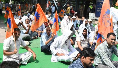 NEW DELHI INDIA AUGUST 28 2024 DTC staff drive and conductor sit on protest dharna under the leadership of Delhi Transport Mazdoor Sangh for their demands at DTC HQ Ring Road on August 28 2024 in New Delhi India Photo by Sonu Mehta Hindustan Times  clipart