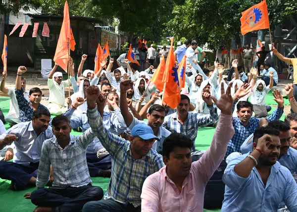 stock image NEW DELHI INDIA AUGUST 28 2024 DTC staff drive and conductor sit on protest dharna under the leadership of Delhi Transport Mazdoor Sangh for their demands at DTC HQ Ring Road on August 28 2024 in New Delhi India Photo by Sonu Mehta Hindustan Times 