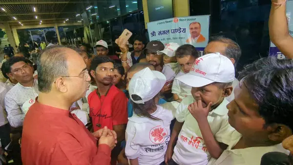 stock image PATNA INDA AUGUST 28 2024 Bihar Health Minister Mangal Pandey with 20 children suffering from hole in the heart for treatment in Ahmedabad at Jaiprakash Narayan Airport on August 28 2024 in Patna India Photo by Santosh Kumar Hindustan Times 