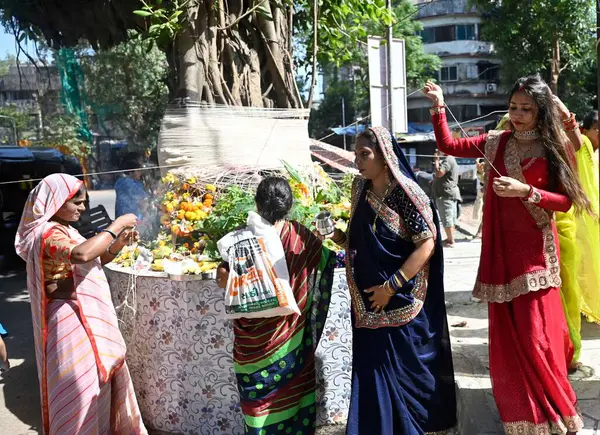 stock image MUMBAI INDIA JUNE 3 2023 Hindu married women observe Vat Purnima by tying ceremonial threads to the Banyan tree and going around it seven times hold Vat Savitri Vrat for the well being and long life of their husbands and desire the same husband in ev