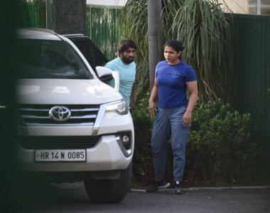 NEW DELHI INDIA JUNE 7 2023 Wrestlers Bajrang Punia Sakshi Malik and others arrive at the residence of Union Minister for Youth Affairs and Sports Anurag Thakur for a meeting on June 7 2023 in New Delhi India On assurance by minister on probe and cha clipart