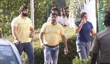 NEW DELHI INDIA JUNE 7 2023 Wrestler Sakshi Malik with husband Satyawart Kadian and others arrive for a meeting with Union Minister for Sports and Youth Affairs Anurag Thakur on June 7 2023 in New Delhi India On assurance by minister on probe and cha clipart