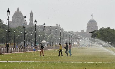 NEW DELHI INDIA JUNE 12 2023 Commuters seen out on a hot summer day at Kartavya path as the heat wave conditions prevailed in Northern India with the maximum temperature settling at 40 degrees Celsius on June 12 2023 in New Delhi India Photo by Sonu  clipart