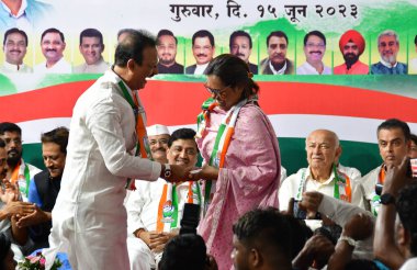 MUMBAI INDIA JUNE 15 2023 MLA Varsha Gaikwad take charge as President Mumbai Regional Congress committee MRCC from her predecessor Bhai Jagtap in the presence of senior Congress leaders Sushil Kumar Shinde Ashok Chavan Prithviraj Chavan Naseem Khan a clipart