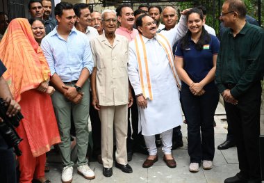 CHANDIGARH INDIA JUNE 15 2023 BJP National President JP Nadda met with Olympian and Arjuna Awardee sport shooter Anjum Moudgil at her residenceas part of the Sampark Se Samarthan campaign on June 15 2023 in Chandigarh Inida Nadda shared the booklet o clipart