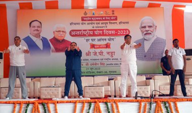 GURUGRAM INDIA JUNE 21 2023 Center JP Nadda BJP National President OP Dhankar Haryana BJP President and MP Dharambir perform yoga on the theme of Har Ghar Aangan Yoga on the 9th International Yoga Day at Tau Devi Lal Stadium Sector 38 near Rajiv Chow clipart