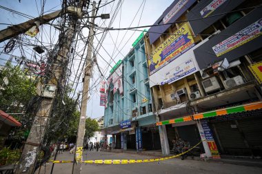 NEW DELHI INDIA JUNE 16 2023 Electric wires seen in open outside the Coaching center where massive fire was broke out yesterday at Commercial Complex near Batra Cinema Mukherjee Nagar on June 16 2023 in New Delhi India Sixty one students were injured clipart