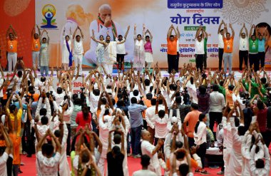 NOIDA INDIA JUNE 21 2023 Minister of Women and Child Development MP Amethi Lok Sabha Constituency Smriti Irani and GBN MP Dr Mahesh Sharma performs yoga on International Yoga Day at Noida indoor Stadium Sector 21 A on June 21 2023 in Noida India Phot clipart