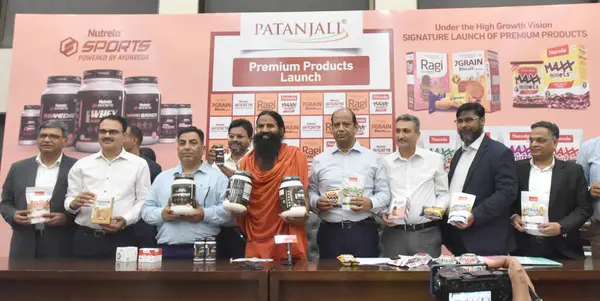 stock image NEW DELHI INDIA JUNE 16 2023 Yoga Guru Baba Ramdev and Patanjali Foods CEO Sanjeev Asthana and others during the launch of Patanjali premium products at Constitution Club of India on June 16 2023 in New Delhi India The products includes Nutrela Max M