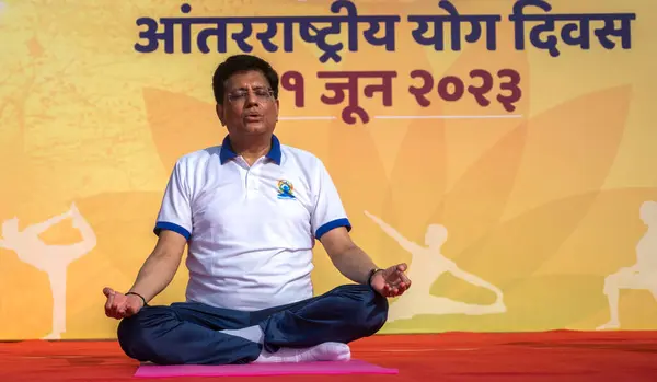 stock image MUMBAI INDIA JUNE 21 2023 Piyush Goyal Leader of the House India perform yoga at Bandra Reclamation Sealink Promenade on the occasion of World Yoga day on June 21 2023 in Mumbai India Photo by Satish Bate Hindustan Times 