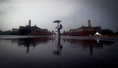 NEW DELHI INDIA JUNE 25 2023 Dark clouds hover over the Vijay Chowk on a rainy day on June 25 2023 in New Delhi India Heavy rainfall accompanied by lightning lashed several parts of the national capital Delhi and its adjoining areas in the early hour clipart