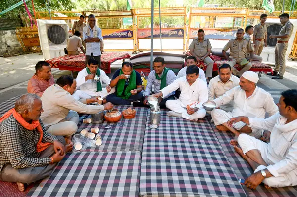 stock image NOIDA INDIA JUNE 18 2023 Farmers gathered to discuss two important topics jaggery and buttermilk on the third day of their ongoing strike against the Noida authority in sector 6 on June 18 2023 in Noida India The strike which has been taking place fo