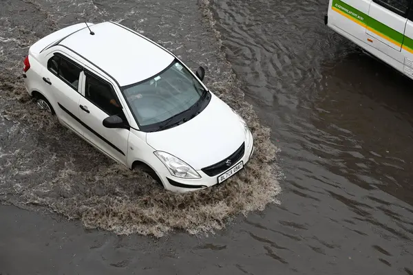 stock image NEW DELHI INDIA JUNE 25 2023 Vehicles move through a waterlogged stretch near the NH24 Near Pandav Nagar in heavy rain on June 25 2023 in New Delhi India Heavy rainfall accompanied by lightning lashed several parts of the national capital Delhi and i