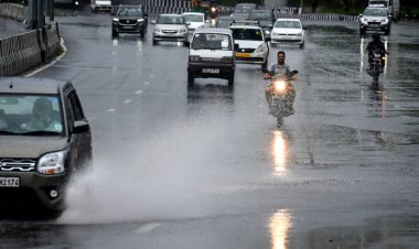 NEW DELHI INDIA JUNE 25 2023 Vehicles move through a waterlogged stretch near the NH24 Near Pandav Nagar in heavy rain on June 25 2023 in New Delhi India Heavy rainfall accompanied by lightning lashed several parts of the national capital Delhi and i clipart