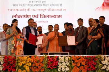 NOIDA INDIA JUNE 25 2023 Uttar Pradesh Chief Minister Yogi Adityanath inaugurated multiple projects of the Noida Development Authority and Greater Noida Authority at Noida stadium Ramlila ground in Sector 21A on June 25 2023 in Noida India On Sunday  clipart