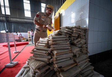 NEW DELHI INDIA JUNE 26 2023 Delhi Police officials seen during a Mass drug destruction program on the occasion of International Day against Drugs Abuse and Illicit Trafficking at a Facility in SSI Industrial Area Jahangirpuri on June 26 2023 in New  clipart