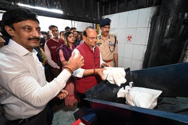 NEW DELHI INDIA JUNE 26 2023 Vinai Kumar Saxena Lieutenant Governor of Delhi along with Delhi Police Commissioner Sanjay Arora during a Mass drug destruction program on the occasion of International Day against Drugs Abuse and Illicit Trafficking at  clipart