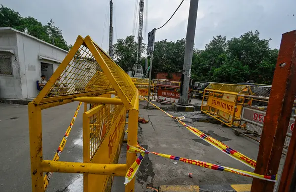 stock image NEW DELHI INDIA JUNE 26 2023 A view of Delhi police barricades the spot where a woman died yesterday of electrocution at New Delhi Railway on June 26 2023 in New Delhi India A 35 year old woman who stepped onto a flooded street at the New Delhi Railw