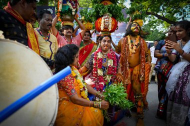 NEW DELHI INDIA JUNE 20 2023 People of Telangana celebrating and dancing during the Lal Darwaza Bonalu celebrations at Telangana Bhawan on June 20 2023 in New Delhi India Bonalu is celebrated usually during Ashada Masam which falls in July August Spe clipart