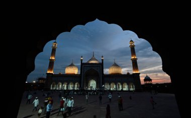 NEW DELHI INDIA JUNE 28 2023 A view of Jama Masjid illuminated on the eve of Eid al Adha festival on June 28 2023 in New Delhi India A day before the festival of Eid ul Azha the Muslim community is gearing up for the day of obedience and submission t clipart