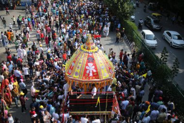 NEW DELHI INDIA JUNE 20 2023 Devotees take part in the annual Jagannath Rath Yatra the festival of chariots at Hauz Khas on June 20 2023 in New Delhi India The Jagannath Puri Rath Yatra is an annual festival celebrated in the city of Puri Odisha The  clipart