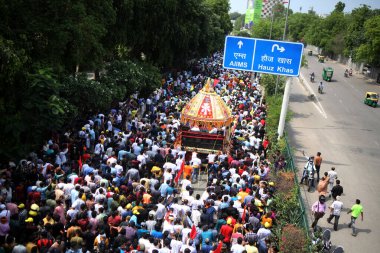 NEW DELHI INDIA JUNE 20 2023 Devotees take part in the annual Jagannath Rath Yatra the festival of chariots at Hauz Khas on June 20 2023 in New Delhi India The Jagannath Puri Rath Yatra is an annual festival celebrated in the city of Puri Odisha The  clipart