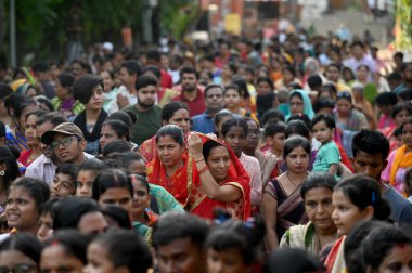 NOIDA INDIA JUNE 20 2023 Devotees enthusiastically pull the chariot of Hindu deities Lord Jagannath his brother Balabhadra and sister Subhadra during the Jagannath Rath Yatra Festival at a temple located in Sector 121 on June 20 2023 in Noida India T clipart