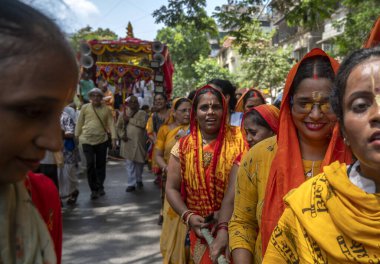 MUMBAI INDIA JUNE 20 2023 Devotees gather to celebrate Jagannath Ratha Yatra procession at Ghatkopar on June 20 2023 in Mumbai India The Jagannath Puri Rath Yatra is an annual festival celebrated in the city of Puri Odisha The festival is believed to clipart