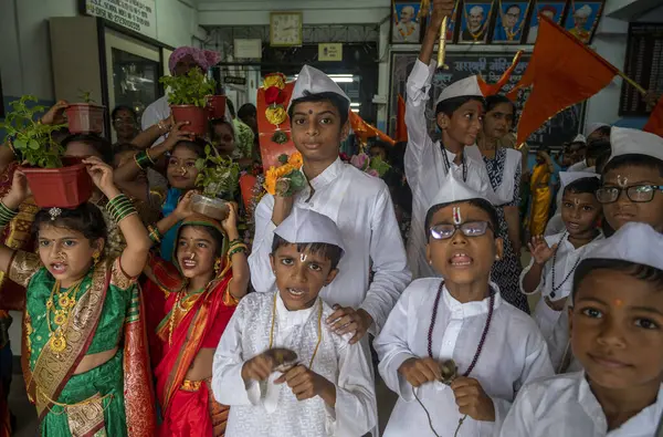 stock image MUMBAI INDIA JUNE 28 2023 Girls dressed in traditional sarees and boys as warkaris pilgrims students of Sarsavati school Mahim participate in a Bal Dindi Yatra procession on the eve of Ashadhi Ekadashi on June 28 2023 in Mumbai India Photo by Satish 